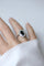 Bague 54 Bague Art déco en platine, saphir ovale et entourage de diamants 58 Facettes