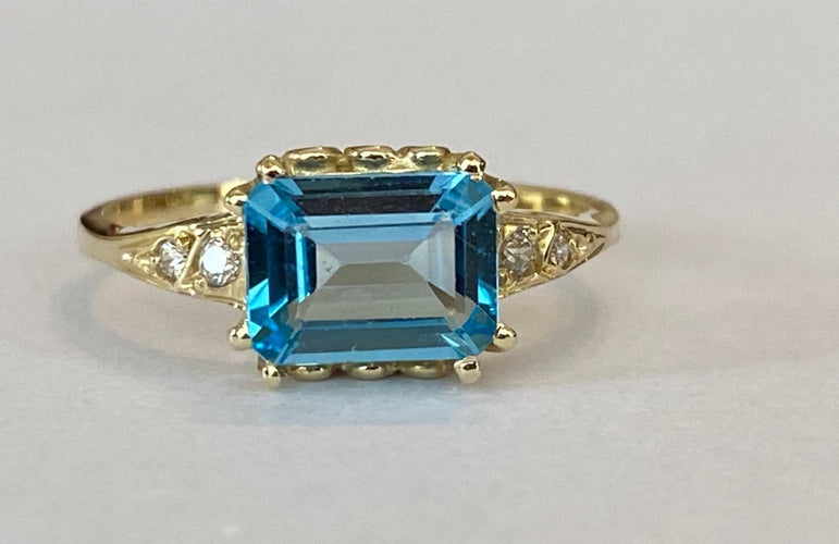 Bague 53 Bague en or jaune 14 carats, topaze bleue et diamants 58 Facettes ring