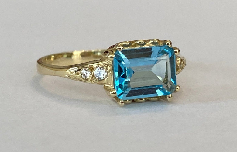 Bague 53 Bague en or jaune 14 carats, topaze bleue et diamants 58 Facettes ring