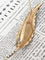 Broche Broche plume en or jaune et blanc 18k avec diamants taille rose 58 Facettes 307