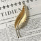 Broche Broche plume en or jaune et blanc 18k avec diamants taille rose 58 Facettes 307