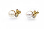 Boucles d'oreilles Boucles d'oreilles en or jaune 14 carats avec perles et diamants 58 Facettes 13579