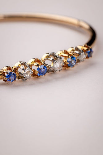 Bracelet Bracelet jonc Belle Époque en or jaune 18 carats et platine, diamants et saphirs 58 Facettes A-015