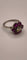 Bague 54 Bague en platine 950 avec diamant central et marguerite de six rubis 58 Facettes Valuor Modèle-015