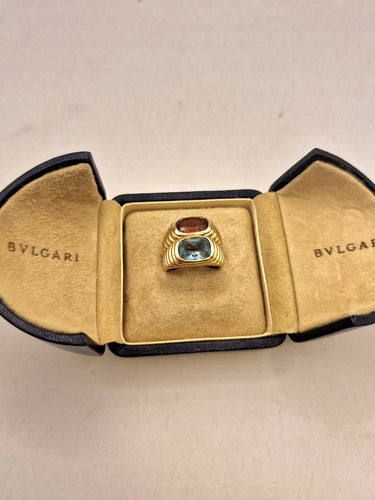 Bague 55 Bulgari - Bague Doppio en or jaune 750, topaze bleue et tourmaline 58 Facettes CV-140