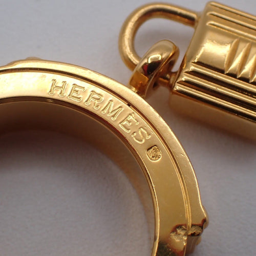 Hermès - Kelly Gavroche en métal plaqué or et cuir 58 Facettes ldansx3lvp