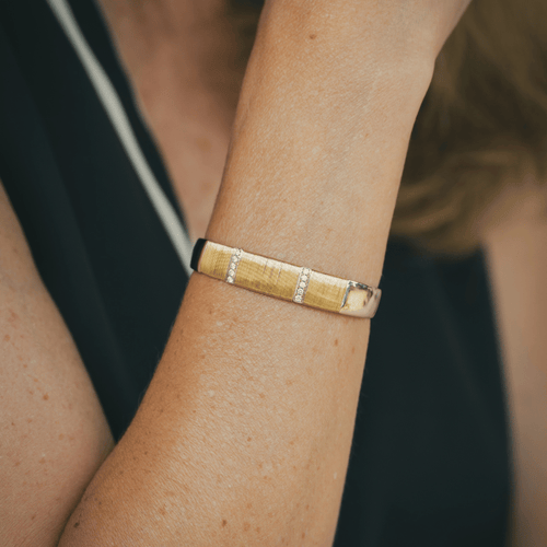 Bracelet Hermès - Bracelet jonc demi-ouvert en or jaune et blanc 18k avec diamants 58 Facettes 50239