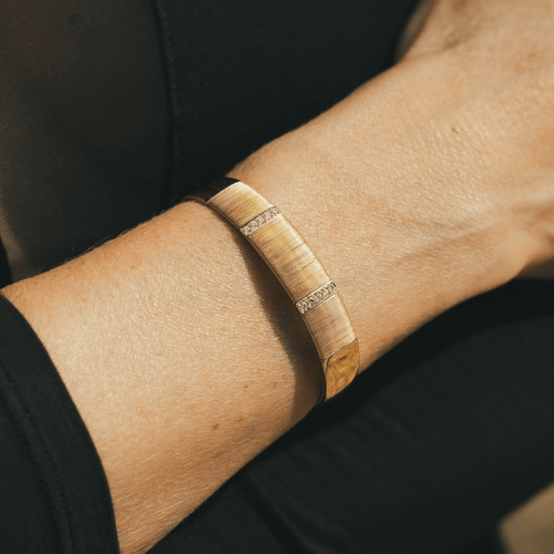 Bracelet Hermès - Bracelet jonc demi-ouvert en or jaune et blanc 18k avec diamants 58 Facettes 50239