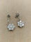 Boucles d'oreilles Boucles d’oreilles pendantes fleur en or blanc 18k et diamants 58 Facettes CV-148