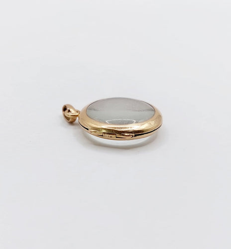Pendentif Pendentif porte-photo reliquaire en or rose 18k, vers 1900 58 Facettes A07972