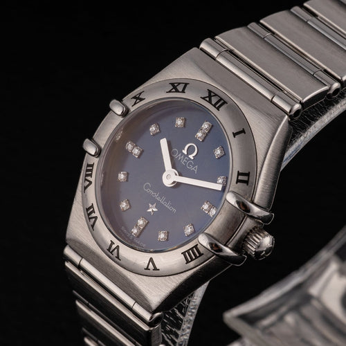 Montre Omega Constellation - Montre femme à quartz, acier, cadran bleu, réf. 1563.86.00 58 Facettes TOT-12001