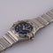 Montre Omega Constellation - Montre femme à quartz, acier, cadran bleu, réf. 1563.86.00 58 Facettes TOT-12001