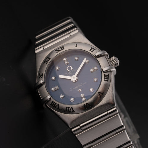 Montre Omega Constellation - Montre femme à quartz, acier, cadran bleu, réf. 1563.86.00 58 Facettes TOT-12001