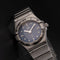 Montre Omega Constellation - Montre femme à quartz, acier, cadran bleu, réf. 1563.86.00 58 Facettes TOT-12001