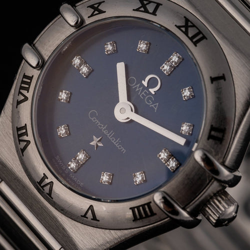 Montre Omega Constellation - Montre femme à quartz, acier, cadran bleu, réf. 1563.86.00 58 Facettes TOT-12001