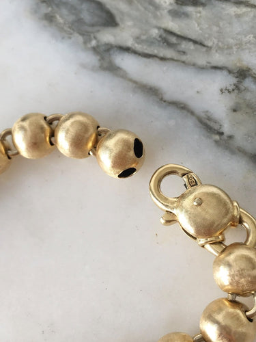 Bracelet Bracelet en or jaune 18k à 21 boules 58 Facettes 308