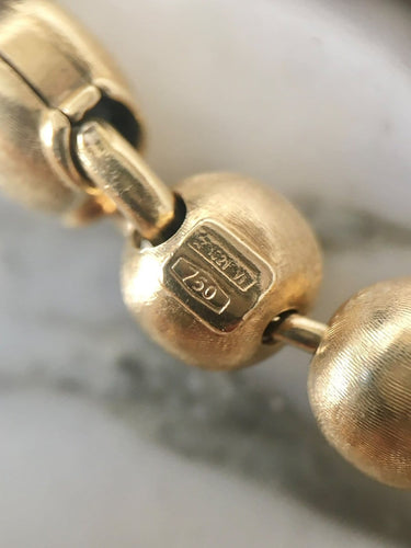 Bracelet Bracelet en or jaune 18k à 21 boules 58 Facettes 308