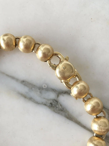 Bracelet Bracelet en or jaune 18k à 21 boules 58 Facettes 308