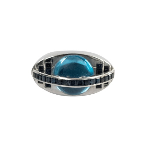 Bague 54 Bague œil en or blanc 18 carats, topaze bleue cabochon et saphirs baguette 58 Facettes