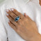 Bague 54 Bague œil en or blanc 18 carats, topaze bleue cabochon et saphirs baguette 58 Facettes