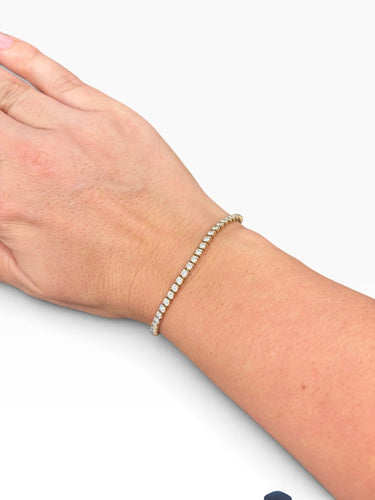 Bracelet Cartier Lignes Essentielles - Bracelet en or rose 18 carats avec diamants 58 Facettes Cartier-tenis-bracelet