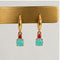 Boucles d'oreilles Boucles d’oreilles créoles en or jaune 18k, turquoise et rubis 58 Facettes 2601016