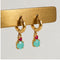 Boucles d'oreilles Boucles d’oreilles créoles en or jaune 18k, turquoise et rubis 58 Facettes 2601016