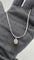 Collier MATY - Collier avec pendentif en or gris 750/1000, émeraude ovale et diamants taille brillant 58 Facettes Collier MATY