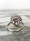 Bague 55.5 Bague marguerite en or blanc 18k, grenat rhodolite et diamants 58 Facettes 313