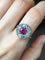 Bague 55.5 Bague marguerite en or blanc 18k, grenat rhodolite et diamants 58 Facettes 313