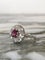Bague 55.5 Bague marguerite en or blanc 18k, grenat rhodolite et diamants 58 Facettes 313