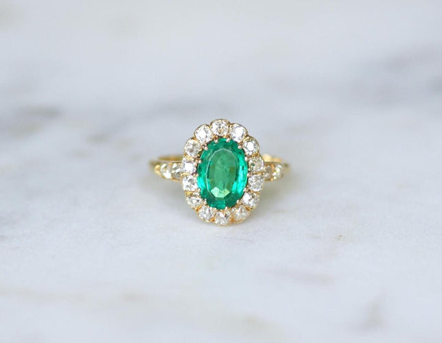 Bague 55 Bague marguerite ancienne en or jaune 18k, émeraude de Colombie et diamants 58 Facettes