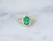Bague 55 Bague marguerite ancienne en or jaune 18k, émeraude de Colombie et diamants 58 Facettes