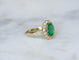 Bague 55 Bague marguerite ancienne en or jaune 18k, émeraude de Colombie et diamants 58 Facettes