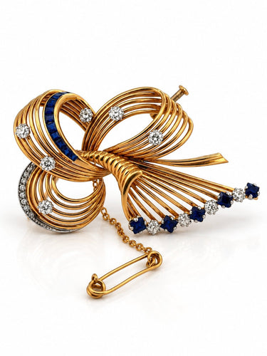 Broche Broche ruban rétro en or 18 carats, diamants et saphirs 58 Facettes 90882