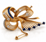 Broche Broche ruban rétro en or 18 carats, diamants et saphirs 58 Facettes 90882