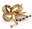 Broche Broche ruban rétro en or 18 carats, diamants et saphirs 58 Facettes 90882
