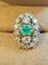 Bague 50 Bague marquise en or blanc et platine, émeraude et diamants 58 Facettes vzvzlzl