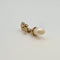 Pendentif Pendentif en or jaune 18 carats serti d’une perle 58 Facettes #2807
