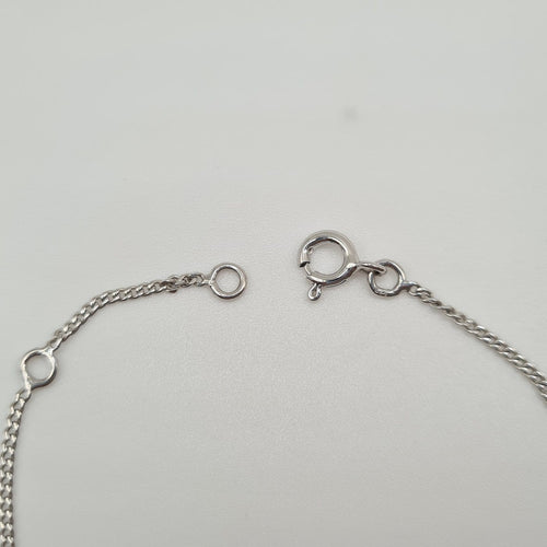 Bracelet Gourmette en or blanc 18 carats 58 Facettes #3234