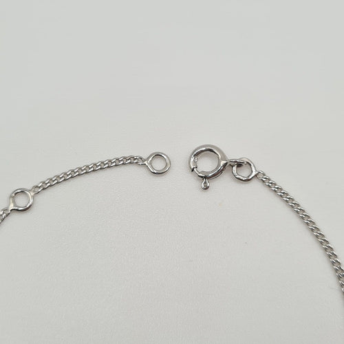 Bracelet Gourmette en or blanc 18 carats 58 Facettes #3280