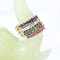 Bague 53 Ensemble de quatre demi-alliances en or jaune 18K, diamants, rubis, émeraudes et saphirs 58 Facettes 2B-XXXX4