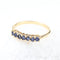 Bague 53 Ensemble de quatre demi-alliances en or jaune 18K, diamants, rubis, émeraudes et saphirs 58 Facettes 2B-XXXX4