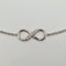 Bracelet Bracelet infini en or blanc 18 carats avec diamants 58 Facettes #3935
