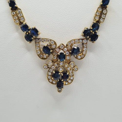 Collier Collier en or jaune 18 carats avec diamants et saphir 58 Facettes #4129