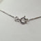 Collier Collier - Chaîne en or blanc 18 carats avec pendentif Raî 58 Facettes #4211 #4986