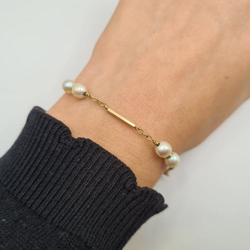 Bracelet Bracelet en or jaune 18k avec perle de culture 58 Facettes #4443
