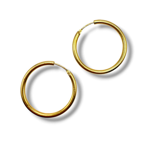 Boucles d'oreilles Créoles en or jaune 18 carats - Travail moderne 58 Facettes
