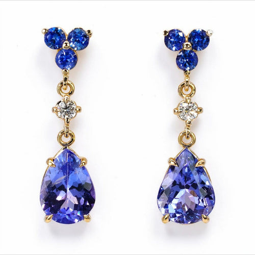 Boucles d'oreilles Boucles d’oreilles pendantes articulées en or jaune 14 carats, tanzanites, saphirs et diamants 58 Facettes E0067