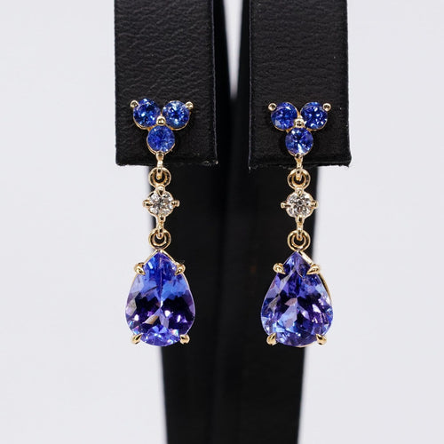Boucles d'oreilles Boucles d’oreilles pendantes articulées en or jaune 14 carats, tanzanites, saphirs et diamants 58 Facettes E0067